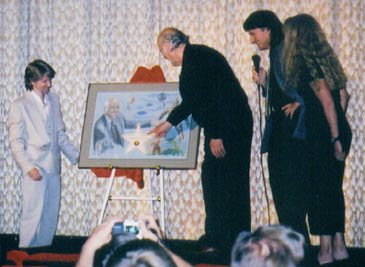 Mike Hansen and Ray Harryhausen unveil commemorative art.